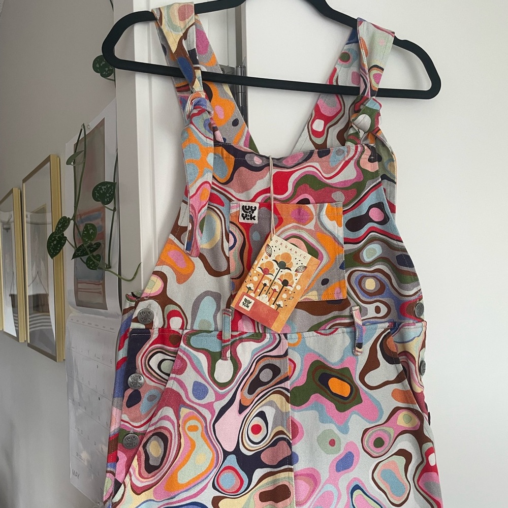 Selling this brand new Lucy & Yak L.E psychedelic pattern Easton dungarees